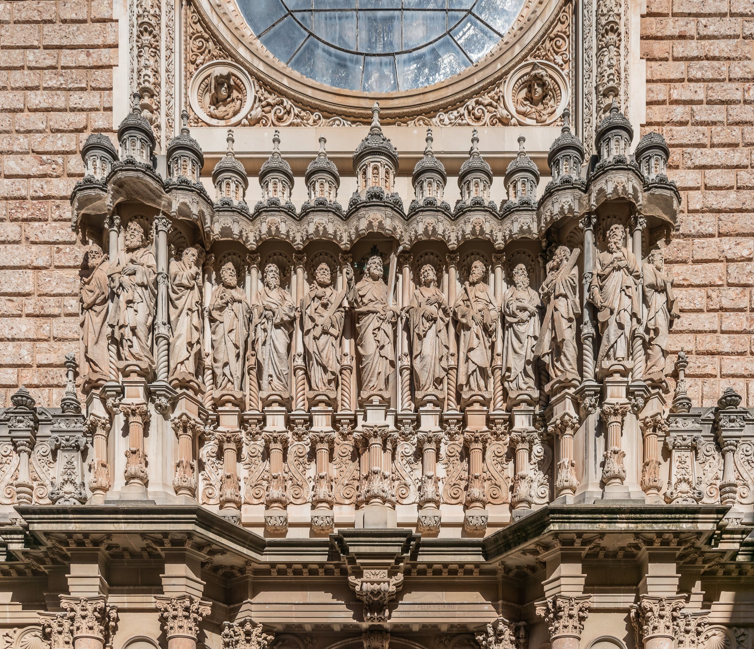 Christ and the Apostles on the facade of the Basilica of Montserrat abbey in commune of Monistrol de Montserrat, Catalonia, Spain