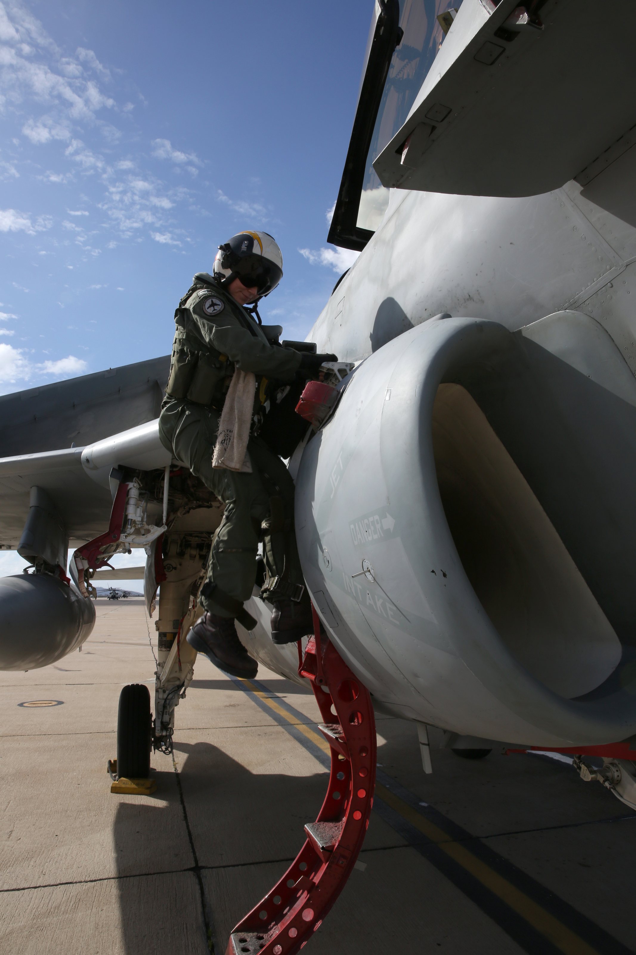 Navy Lt. Ana Brown, an EA-6B Prowler pilot with Electronic Attack Squadron 131 from Naval Air Station Whidbey Island, Wash., disembarks from the aircraft after flying it to Marine Corps Air Station Miramar, Calif., Feb. 