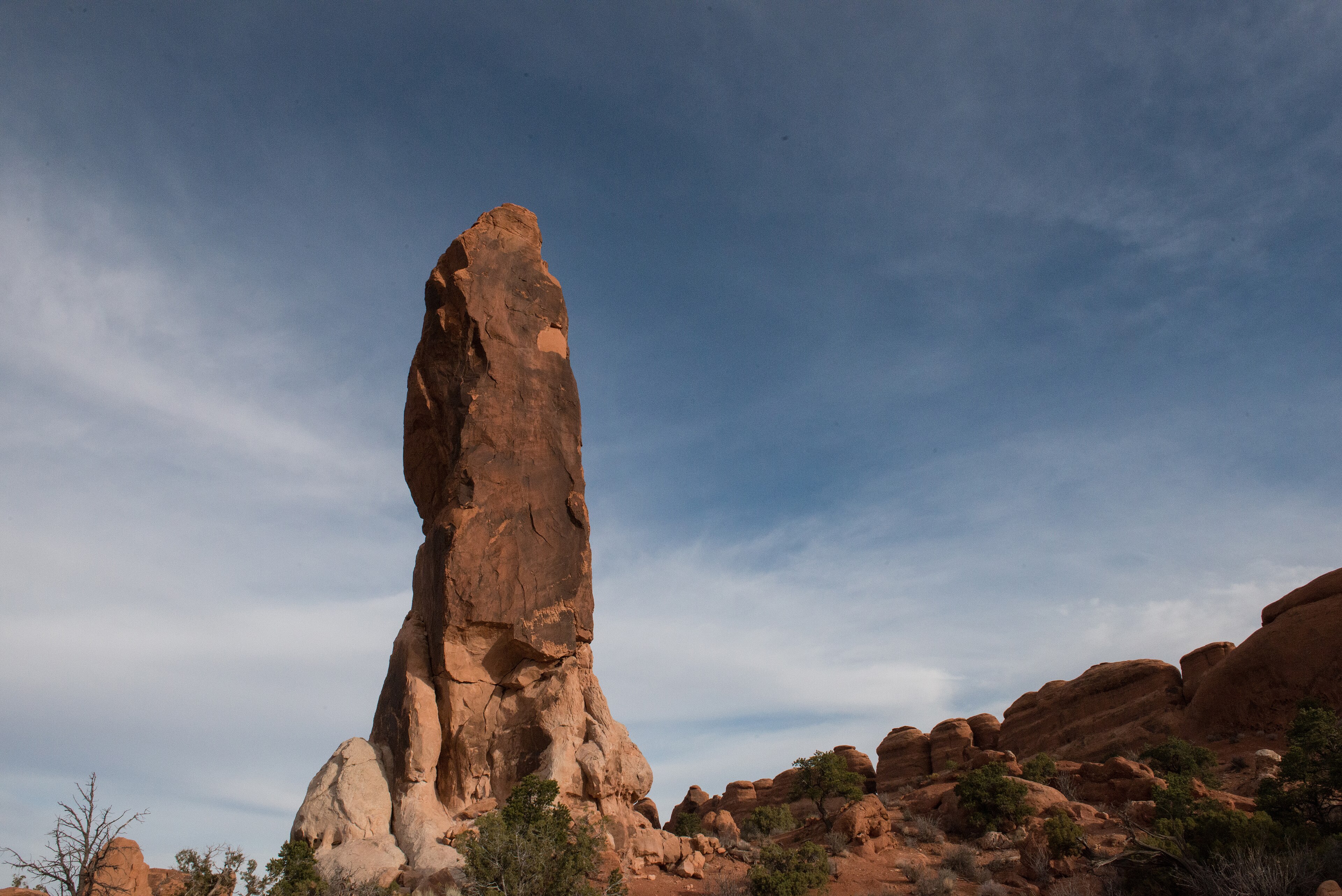 a tall, isolated stone monolith 
 The tall monolith called Dark Angel stands at the north end of Devils Garden. 
  Keywords: arches; dark angel; devils garden; sandstone; monolith
