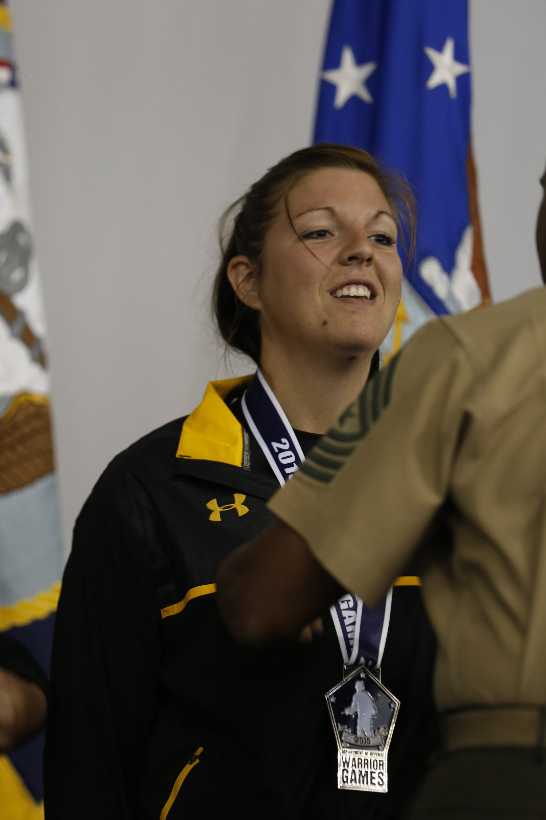 U.S. Army Staff Sgt. Ashley Anderson, Warrior transition Batalion, Fort Riley, Kan., receives the silver medal for the Women's Shot Put Standing 6.0 category at the 2015 Department of Defense Warrior Games, Marine Corps 