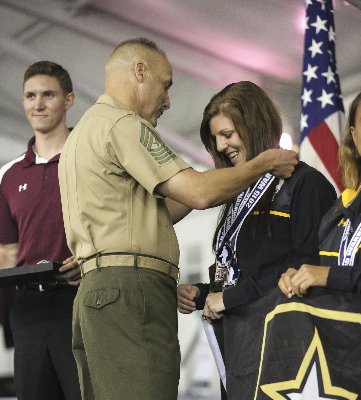U.S. Army Staff Sgt. Ashley Anderson, Warrior Transition Battalion, Fort Riley, Kan., receives the bronze medal for the Women's 50-meter backstroke 6.0 swimming event at the 2015 Department of Defense Warrior Games at Ma