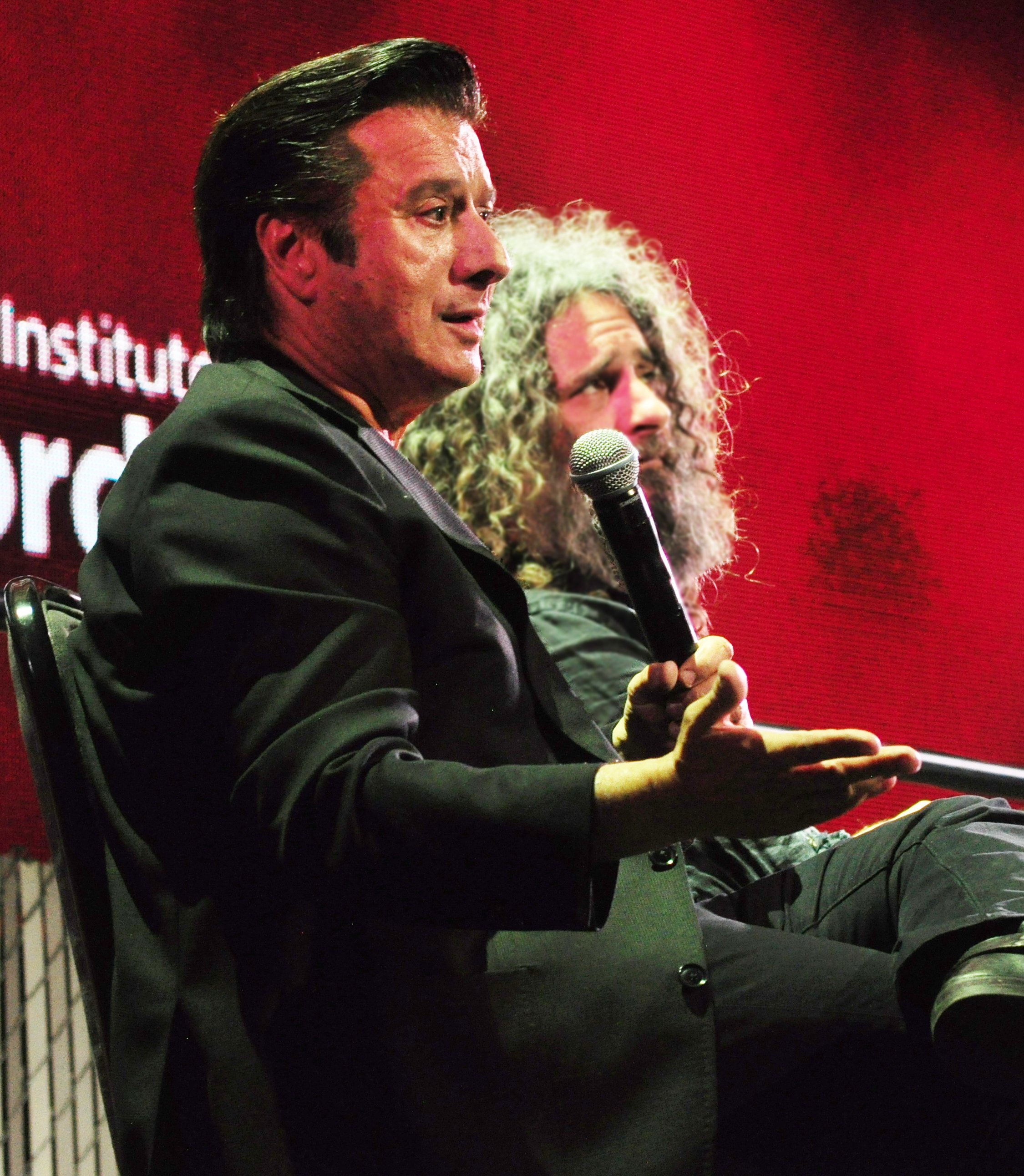 Steve Perry on the keynote panel, "Going Up Yonder: How Music Makers and Writers Confront Loss and Grief", Pop Conference 2019, MoPOP, Seattle Center, Seattle, Washington. Efrim Manuel Manuck in background.