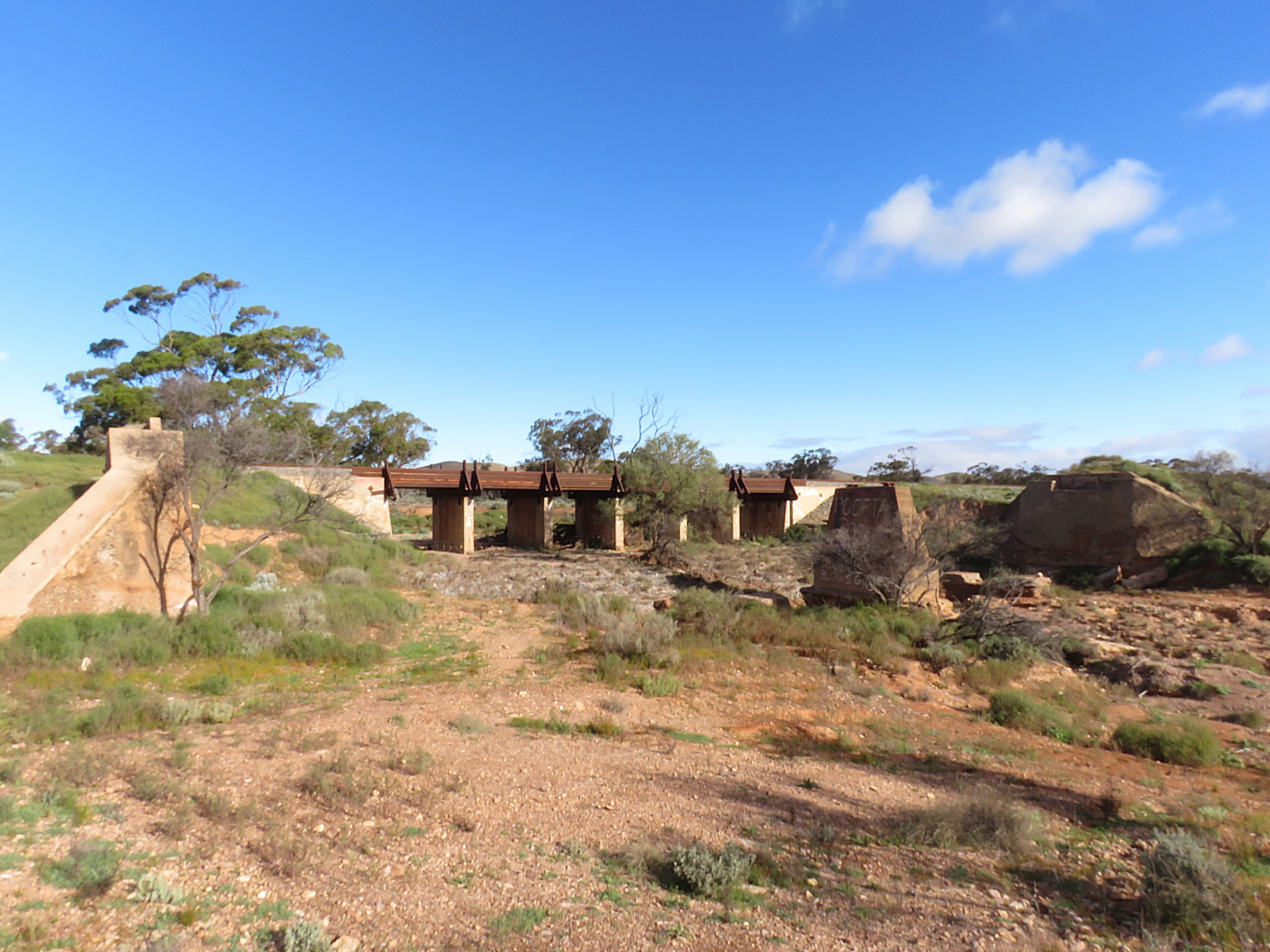 The Crystal Brook–Broken Hill railway line bridge over the Cavanagh Chase, South Australia. It is located west of Mannahill, in the locality of Winnininnie, near the tourist attraction of the Big Dice. The old railway br