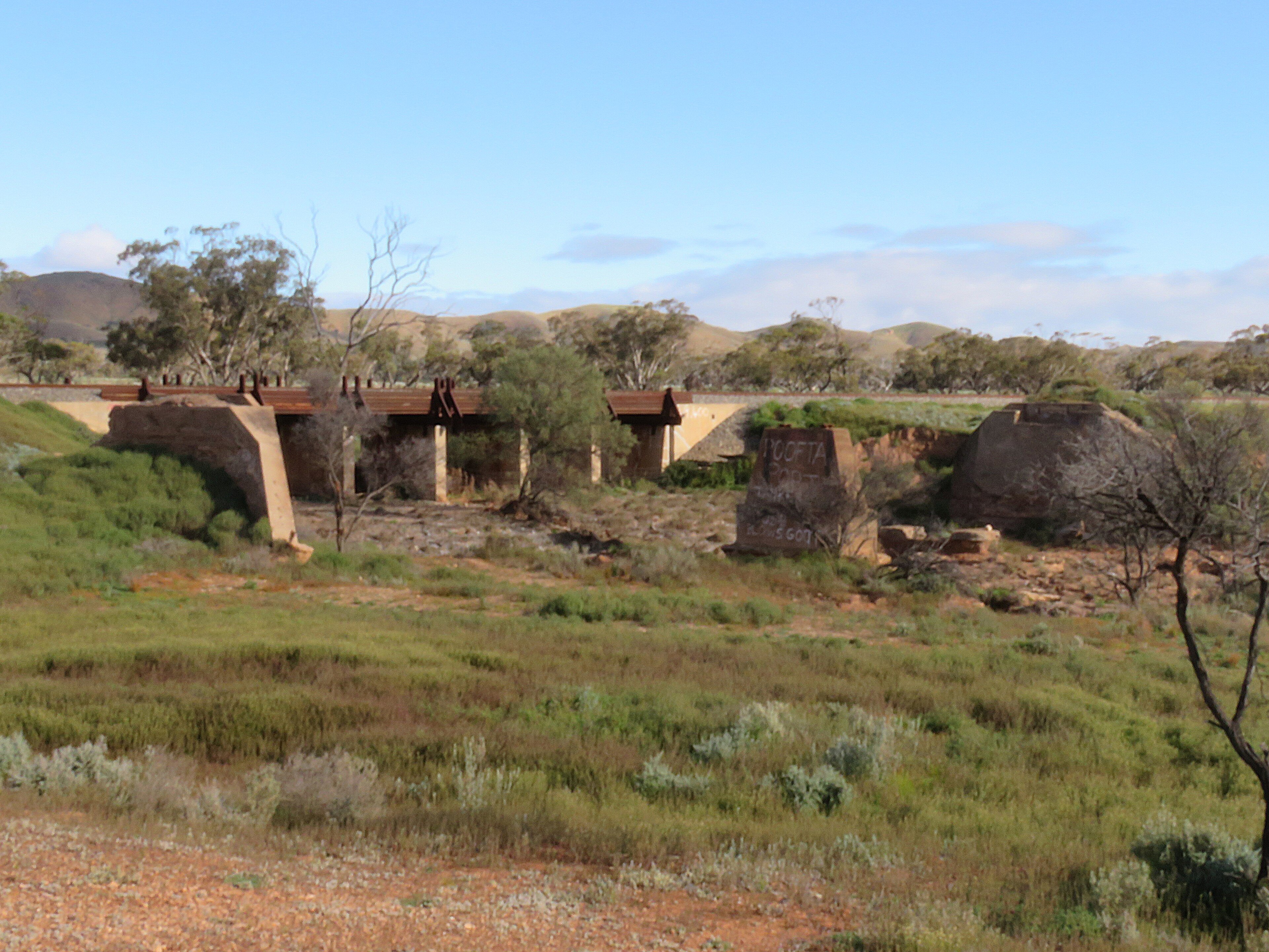 The Crystal Brook–Broken Hill railway line bridge over the Cavanagh Chase, South Australia. It is located west of Mannahill, in the locality of Winnininnie, near the tourist attraction of the Big Dice. The old railway br