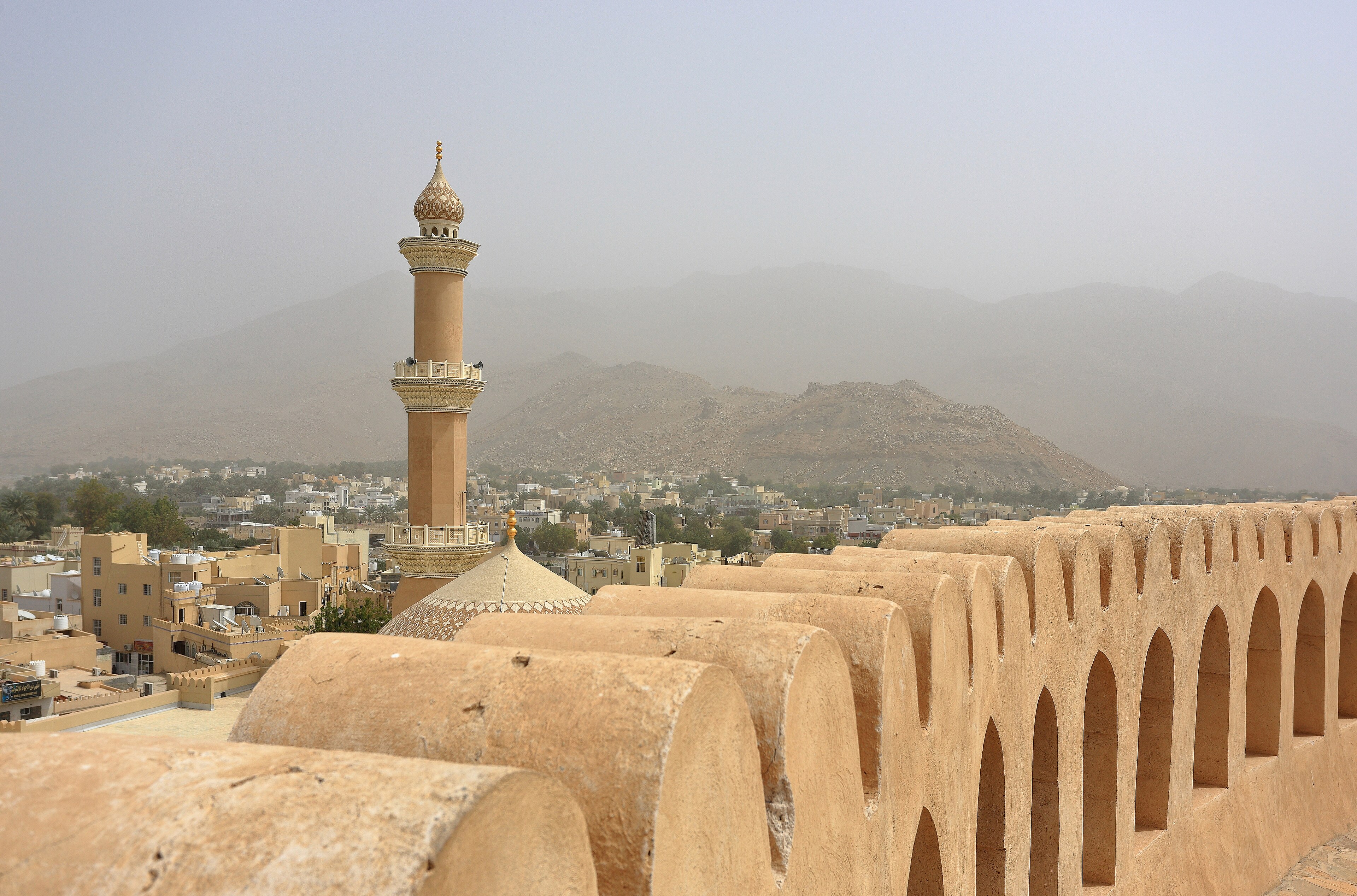 The minaret of Friday Mosque as seen from  Nizwa Fort ,  Nizwa ,  Oman .