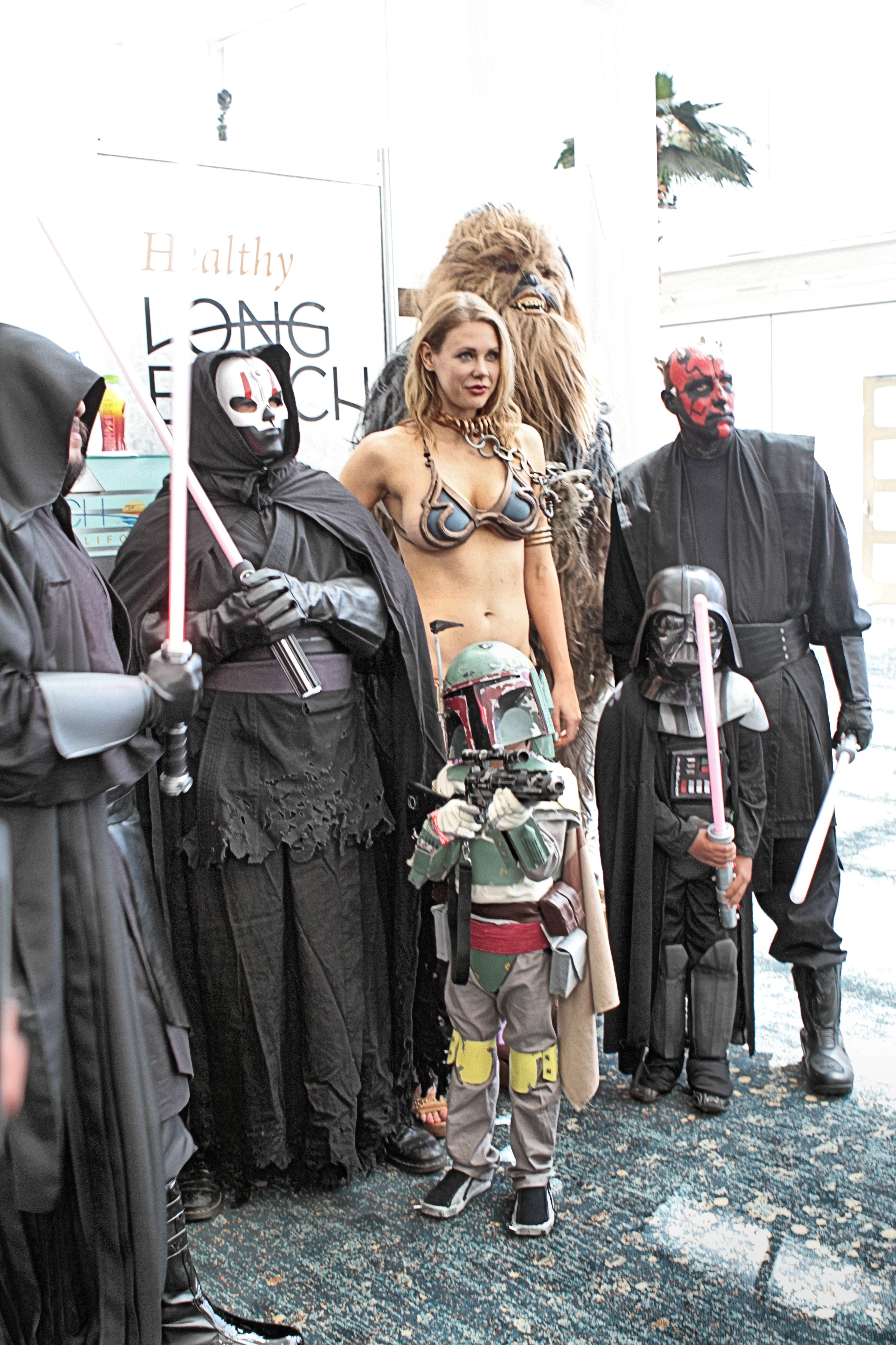 Cosplay at Long Beach Comic Expo 2014. From left to right, back row: An unidentified Sith, Darth Nihilus, Slave Leia (cosplayed by Maitland Ward), Chewbacca, and Darth Maul; front row: Boba Fett, and Darth Vader.
