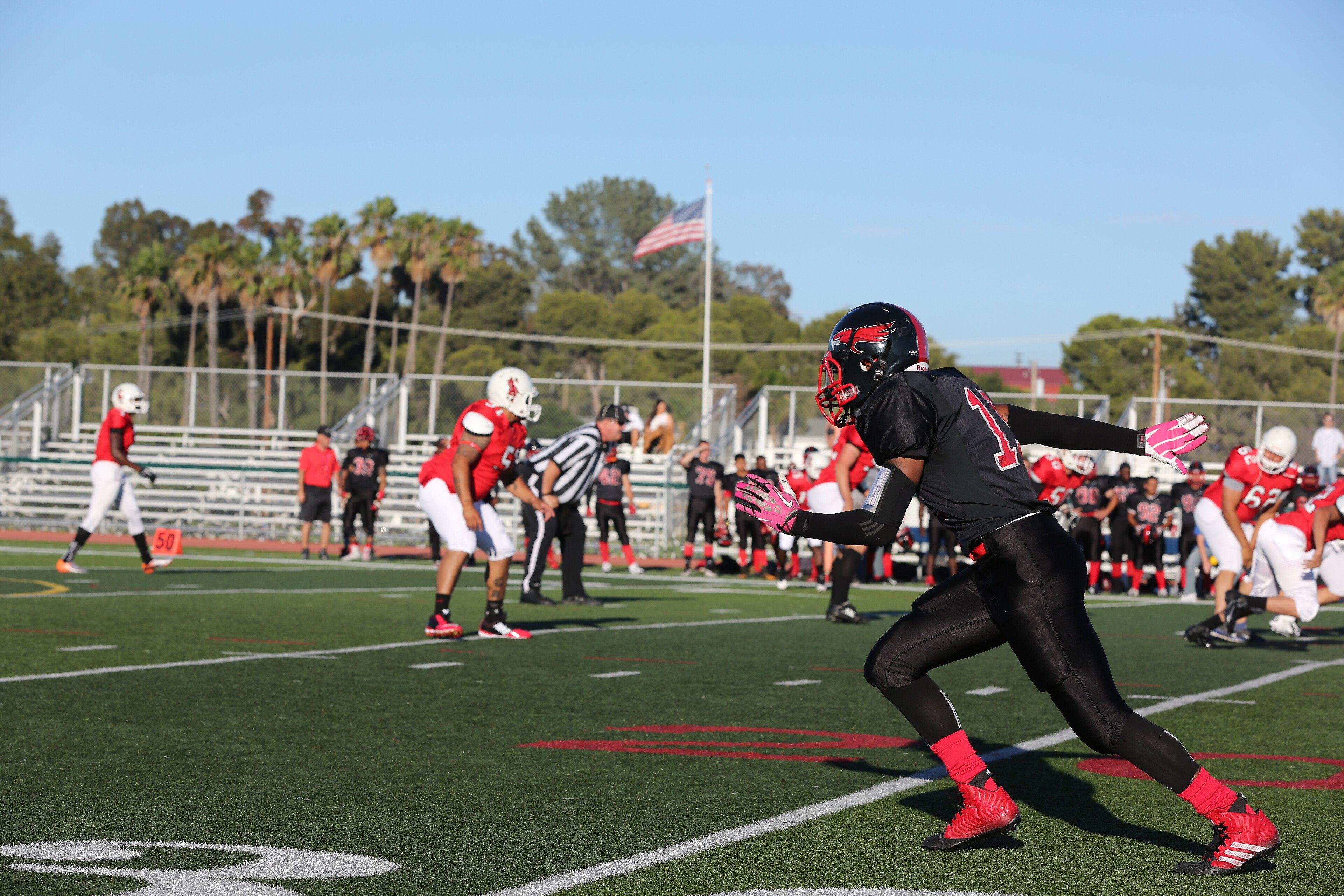 Jabari Moore, Marine Corps Air Station Miramar Falcons’ wide receiver, explodes off the line of scrimmage during a game against the Headquarters Battalion, 1st Marine Division Standard Bearers at Paige Field House aboard