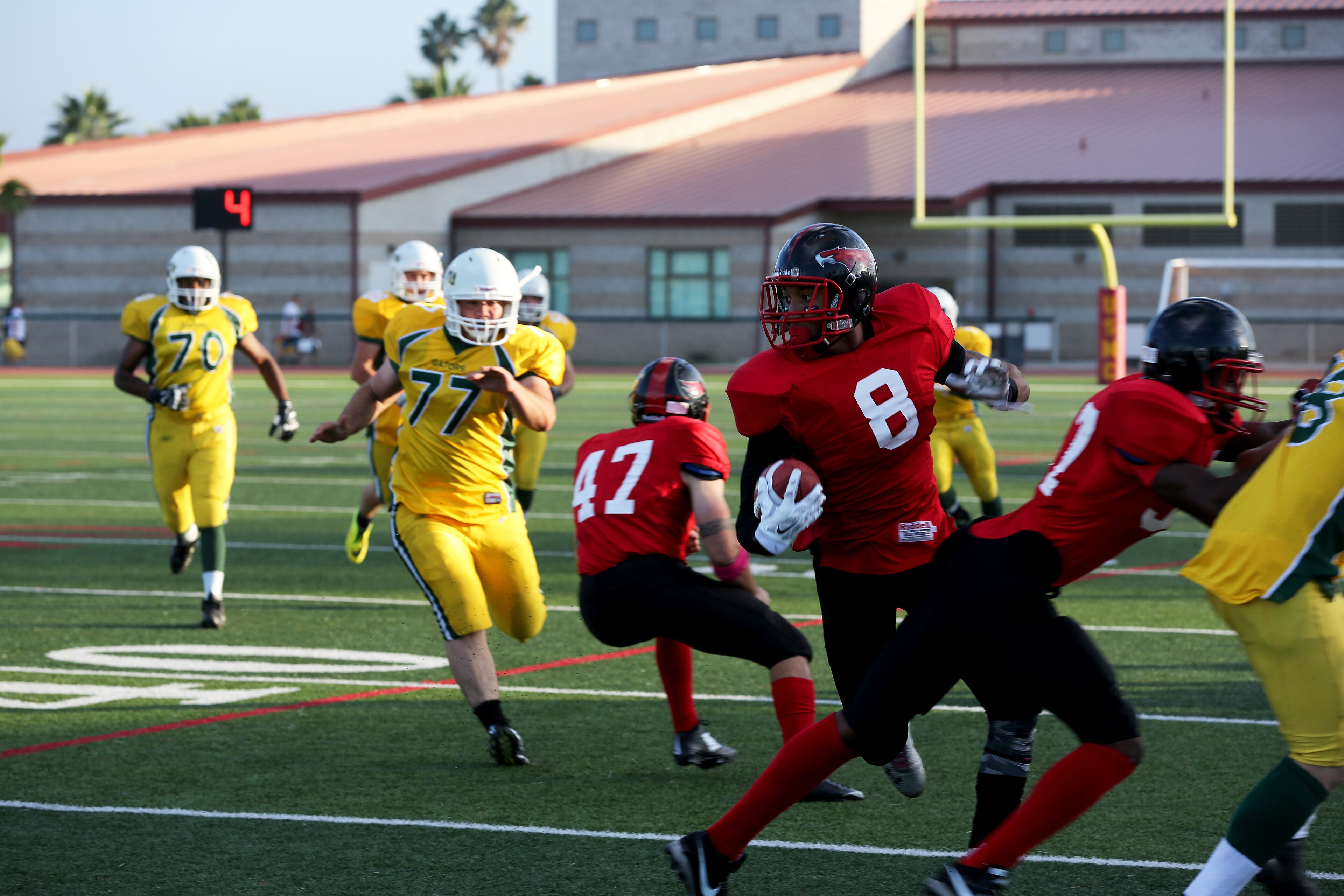 Dwayne Bracy, Marine Corps Air Station Miramar Falcons’ punt returner, dodges defenders during a game at Paige Fieldhouse aboard Marine Corps Base Camp Pendleton, Calif., Oct. 21. The Falcons eliminated the Gators from t