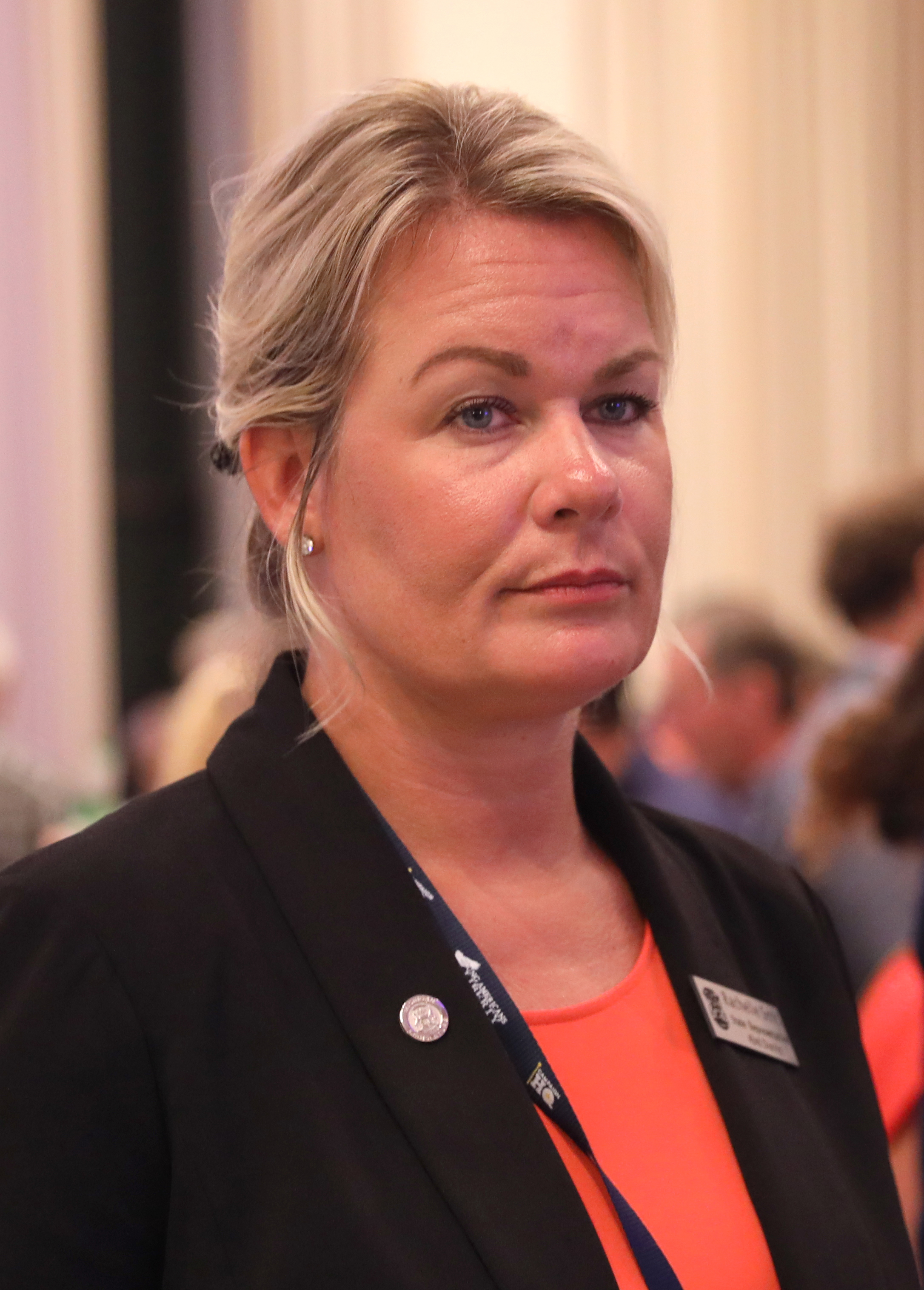 Rachelle Smit  speaking at an event in Kissimmee, Florida.
