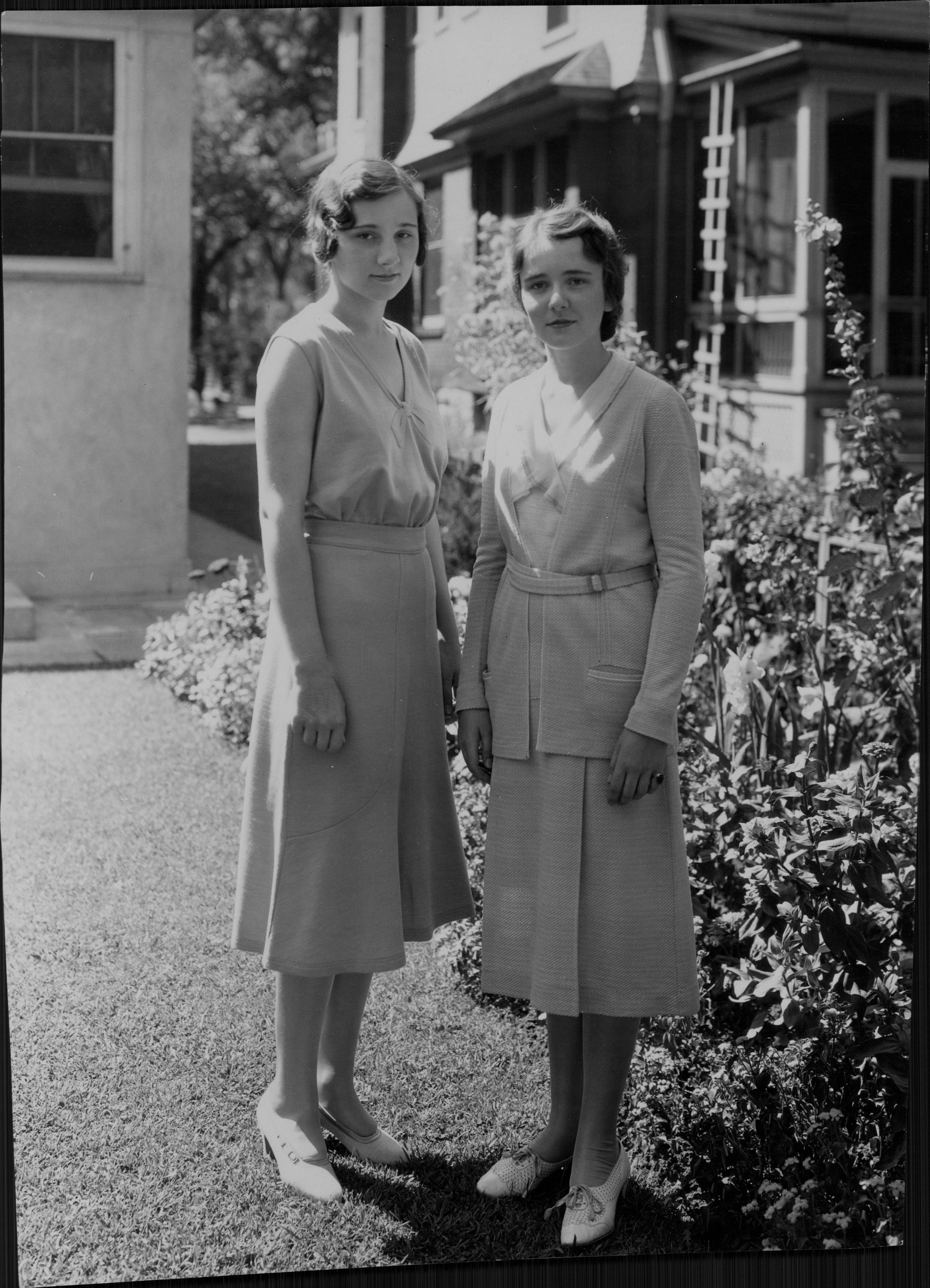 Margaret (left) and Ruth (right) of Geneseo, Illinois, are guests of James Sutherland at the Lafayette Club party.