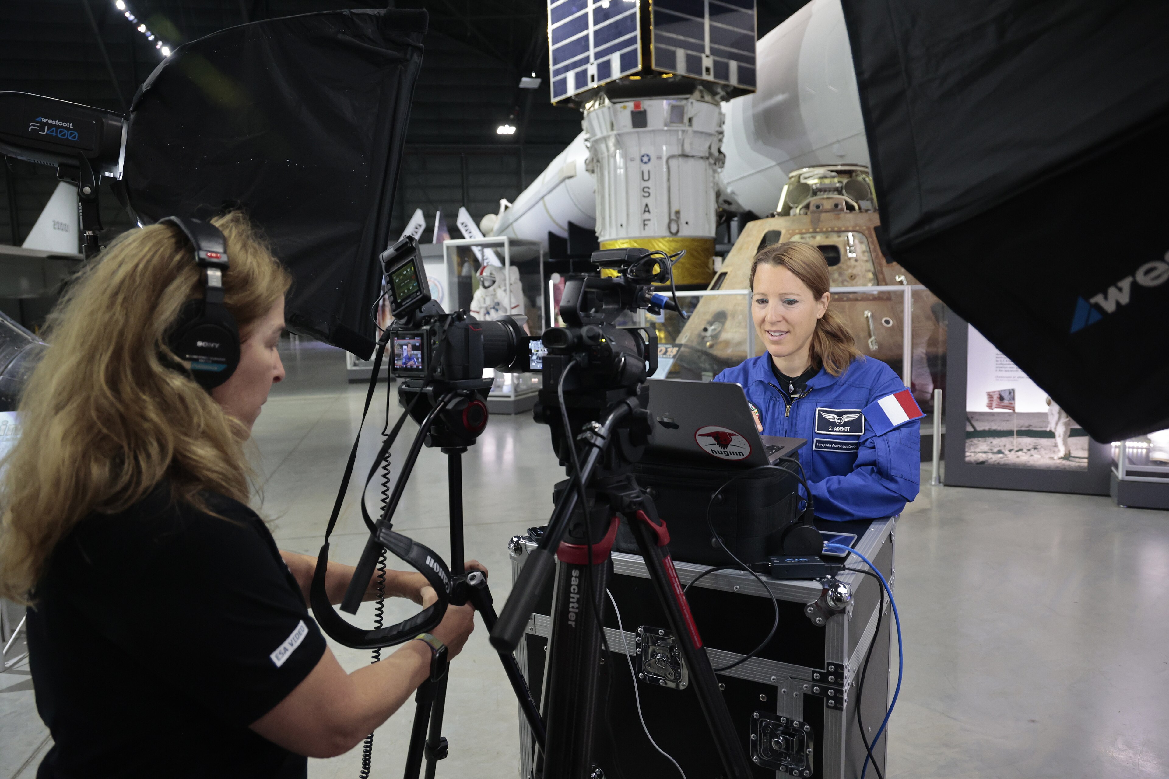 European Space Agency Astronaut Sophie Adenot, right, speaks to French President Emmanuel Macrone from the Space Gallery in the National Museum of the U.S. Air Force in June of 2025. Adenot had been training in a centrif