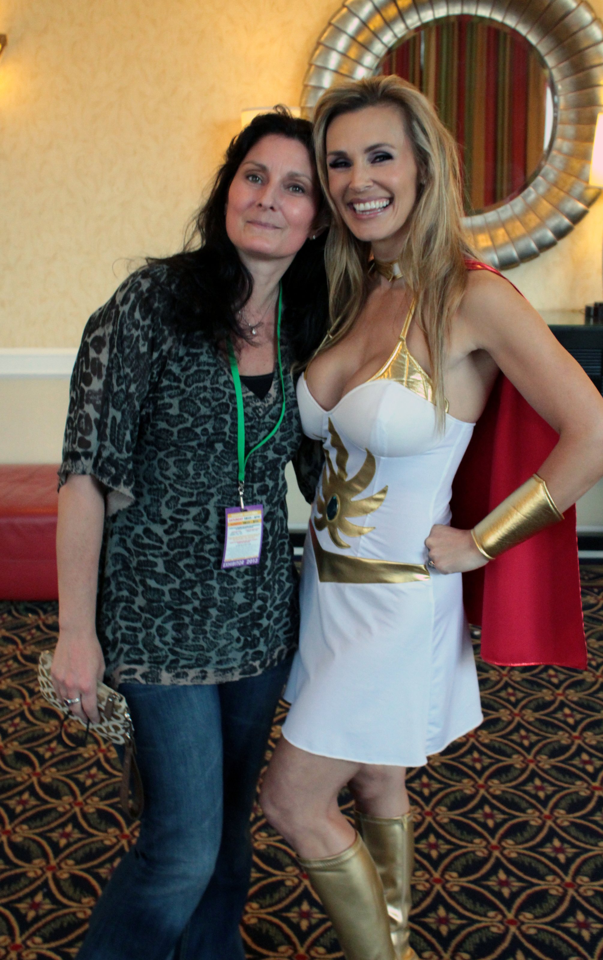 Toy prototype painter Sherri Lynn Cook (left; of Four Horsemen Studios) and actress Tanya Tate (right; cosplaying as She-Ra) at Power-Con 2013 in Torrance, California, United States.  Power-Con is a fan convention dedica